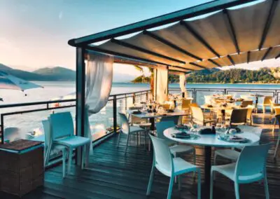 a restaurant with a view of the water